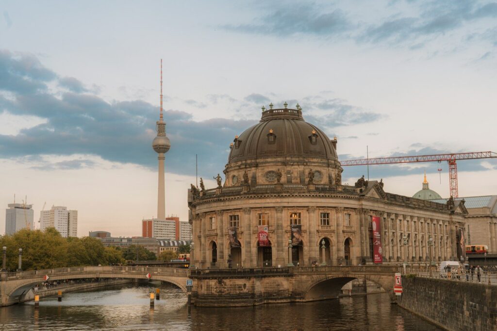 A berlin skyline with a building and the TV tower.